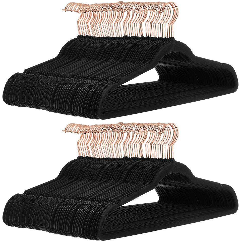 Amazon Basics slim velvet non-slip hangers show space-saving closet organization for shirts and jackets.