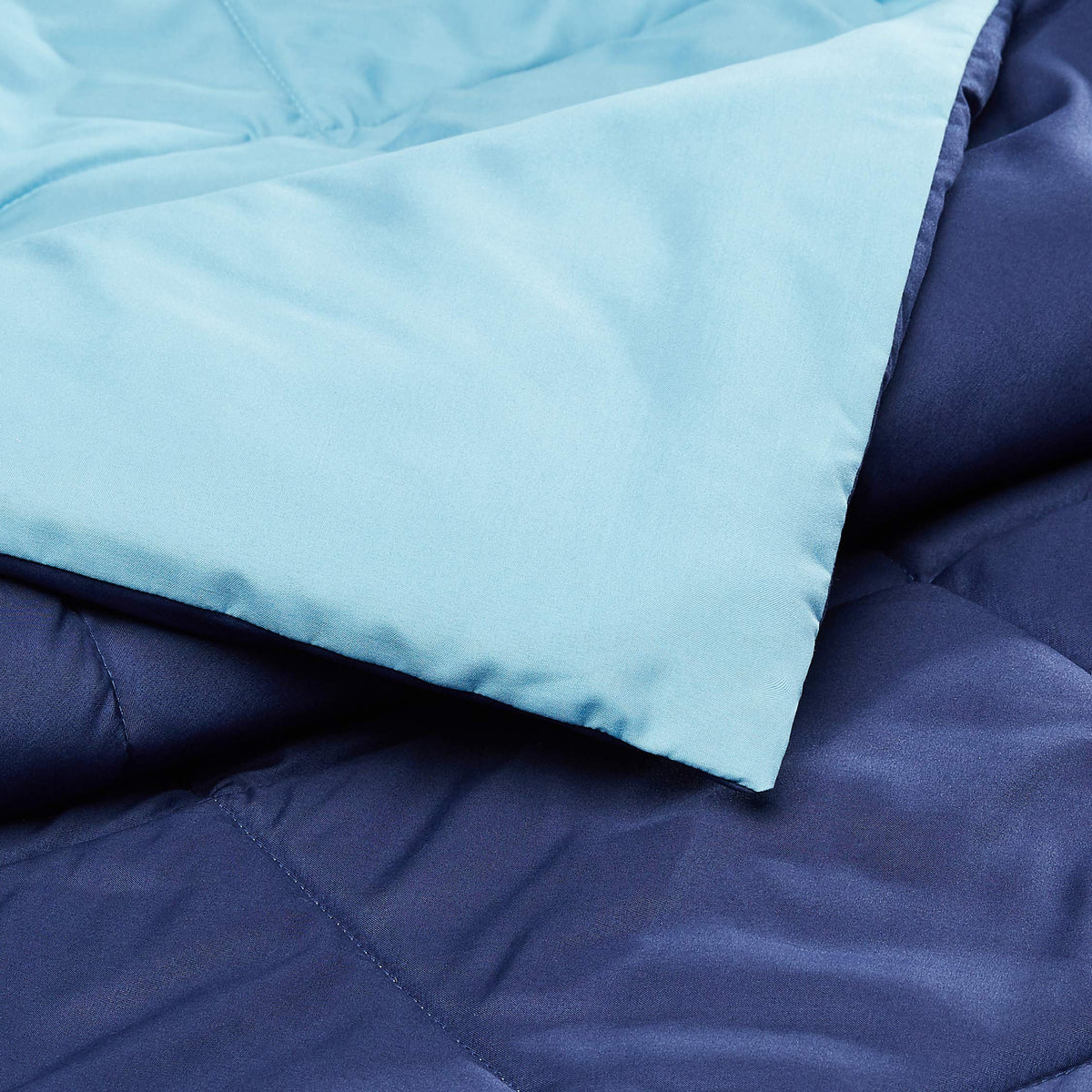 Amazon Basics microfiber comforter being machine washed for quick refresh.