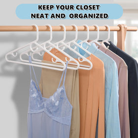 Amber Home closet organization solution with white hangers.