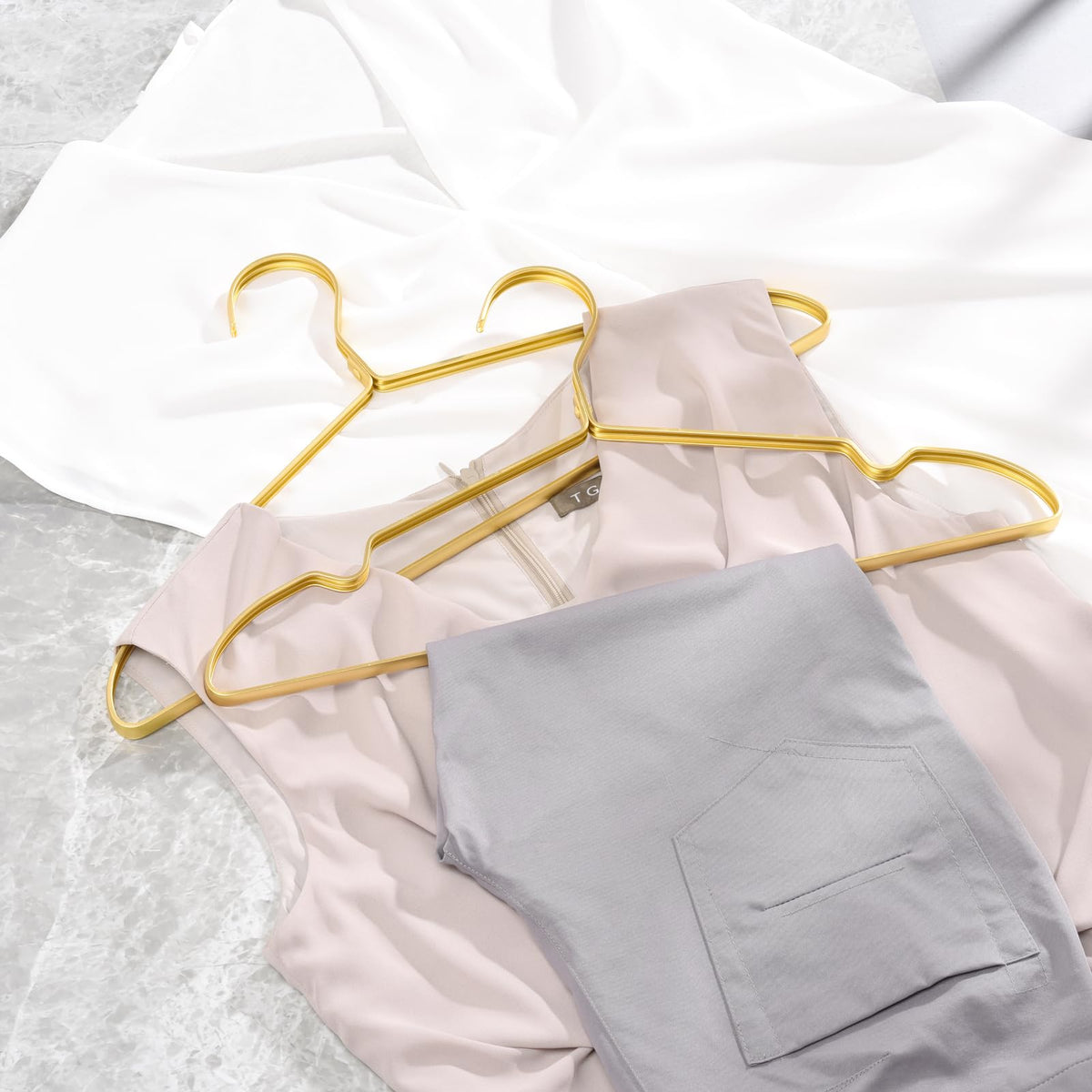 Amber Home hangers with extra-large notches for camisoles.