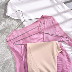 Amber Home slim-profile hangers prevent sagging and keep garments neat.