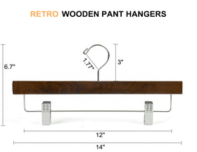 Close-up of Amber Home hanger showing smooth wood surface and clip mechanism.