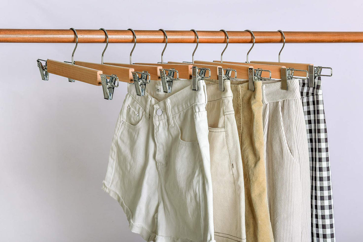 Amber Home tidy pants and jeans on sleek hangers.