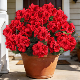 AmberFun artificial red geraniums in a six-bundle outdoor display brighten planters.