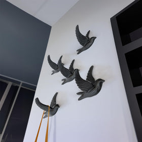 Close-up of Ambipolar gull-design coat hook showing robust iron construction