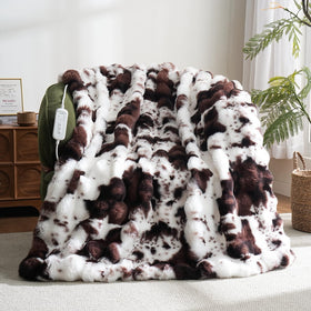 Ambrebellum cow-print heating throw in brown for instant cozy warmth.