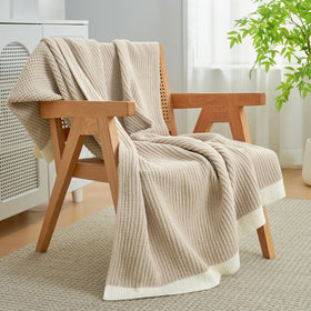 Amélie Home chenille throw suits bed and lounge for extra warmth.