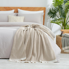 Amélie Home chenille throw is machine-washable and durable for busy homes.