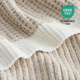 Amélie Home chenille throw drapes beautifully as a sofa decor piece.