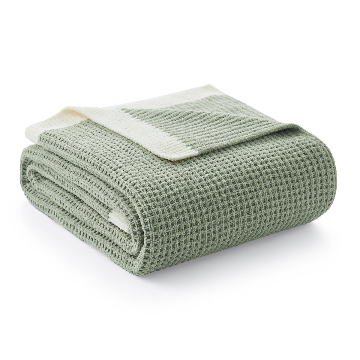 Amélie Home chenille throw with ultra-soft finish draped on a couch for cozy lounging.