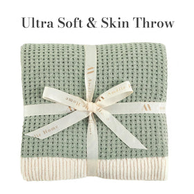 Amélie Home chenille throw waffle-knit texture close-up, adding warmth and depth to living room decor.