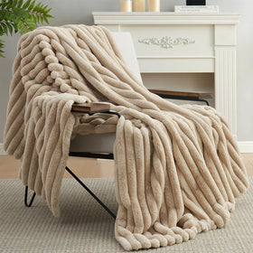 Amélie Home blanket draped over chair for a relaxed vibe