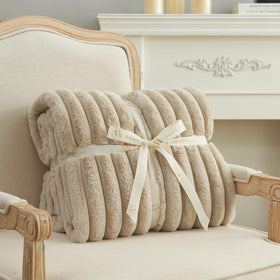 Gift-ready beige Amélie Home faux fur throw blanket