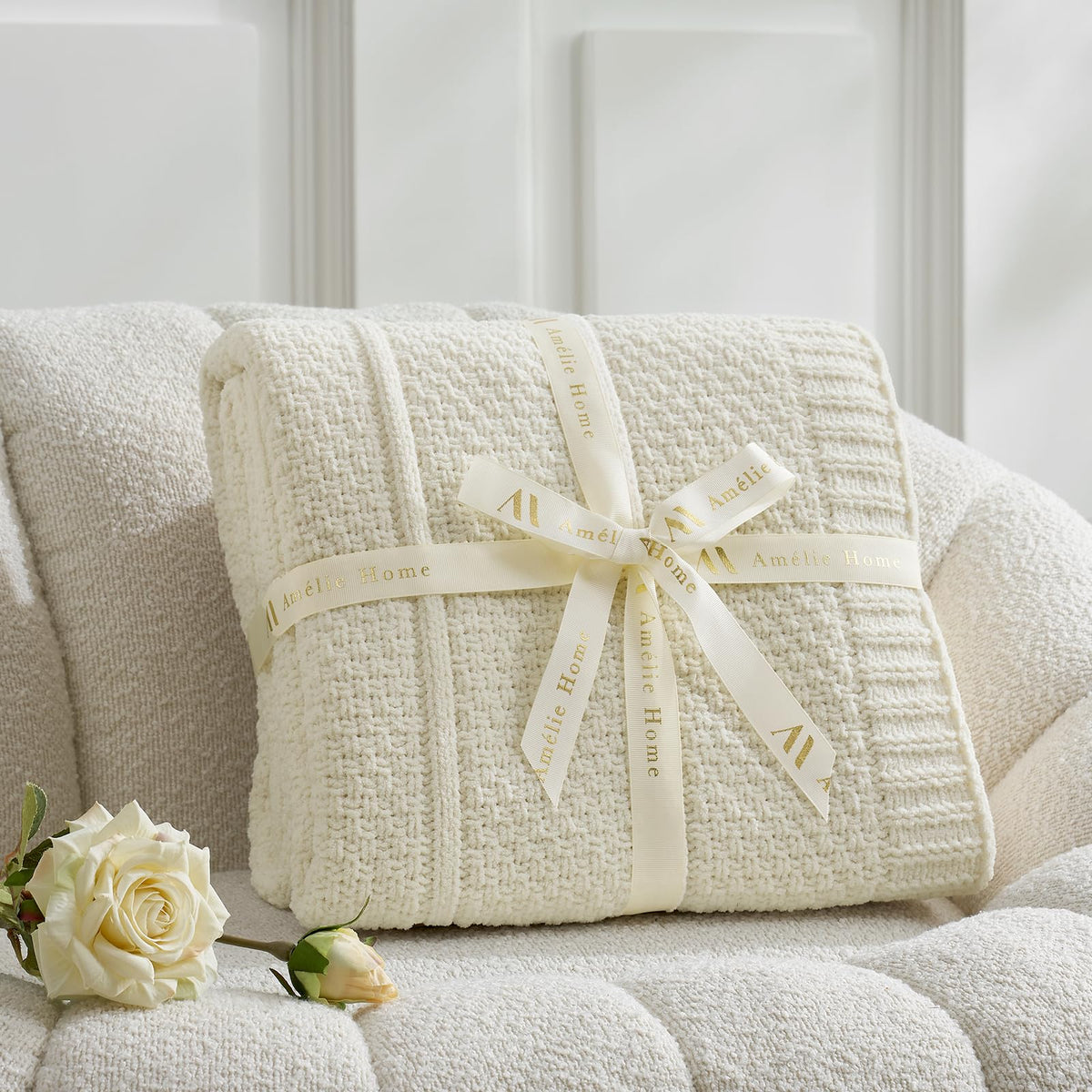 Amélie Home cozy throw on couch creating ambient, inviting living room atmosphere