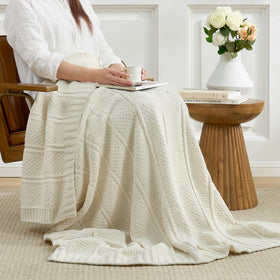 Amélie Home blanket at bed foot for added texture and comfortable layer
