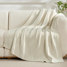 Amélie Home chenille throw draped on sofa for elegant, lightweight warmth