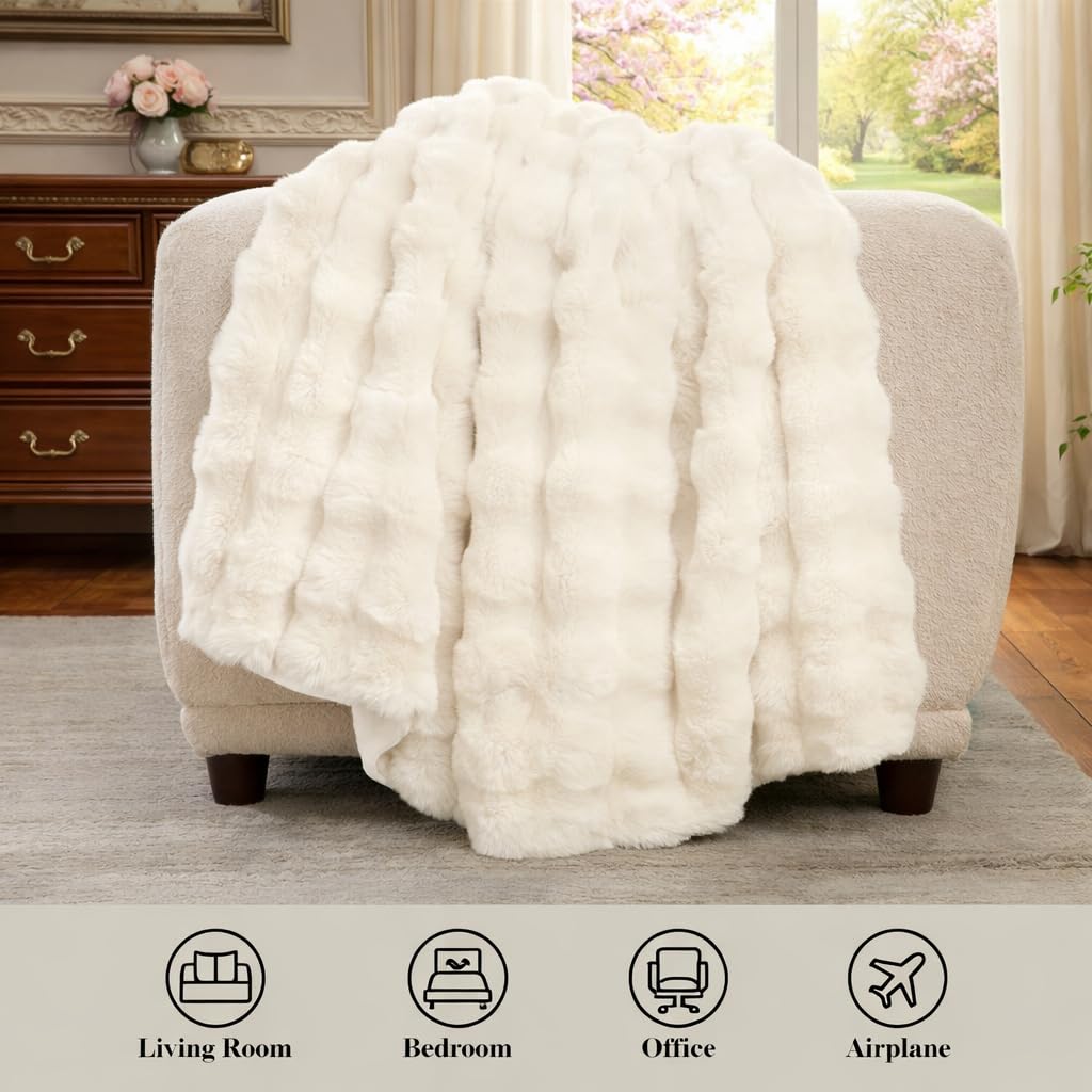 Amélie Home cream throw draped on sofa, enhancing comfort and style.