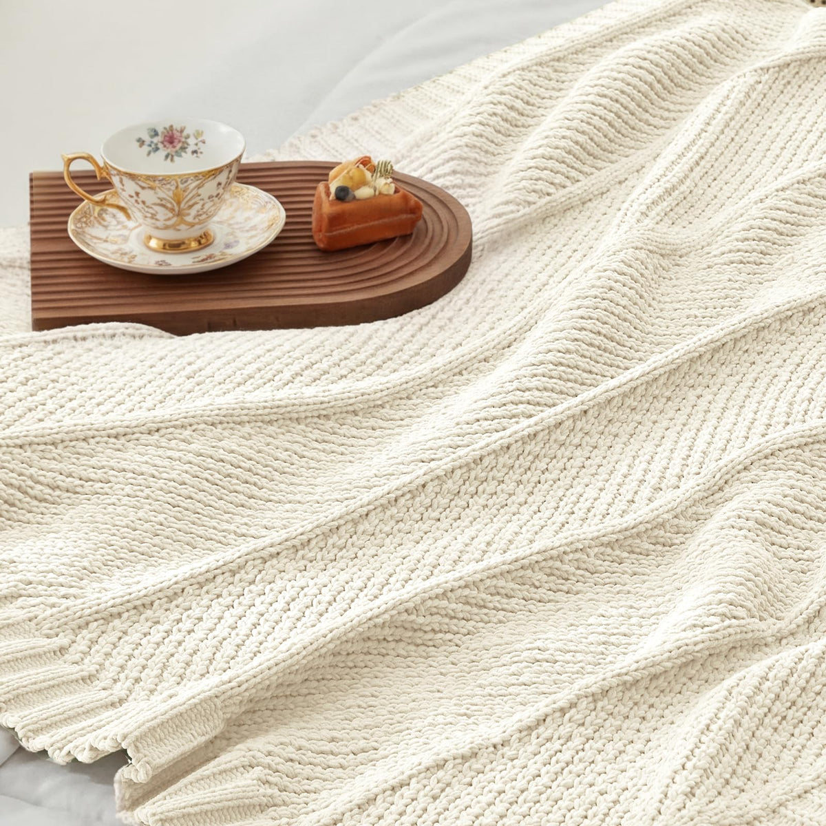 Amélie Home gift-ready throw offers comforting warmth.