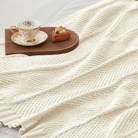 Amélie Home gift-ready throw offers comforting warmth.