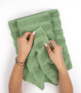 American Soft Linen 4-piece set in a basket suggests complete bathroom set