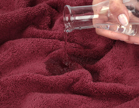 American Soft Linen Bordeaux red towels in a modern bathroom setting.