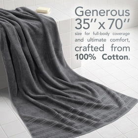 American Soft Linen dark gray towel draped on chair for bathroom luxury