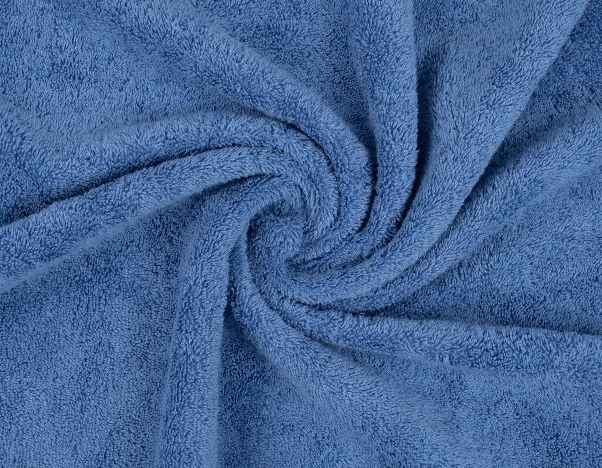 American Soft Linen electric blue towel set highlighting vibrant bathroom accent.
