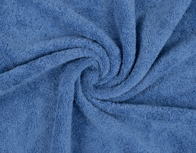 American Soft Linen electric blue towel set highlighting vibrant bathroom accent.