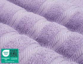 Four-piece towel set laid out by American Soft Linen