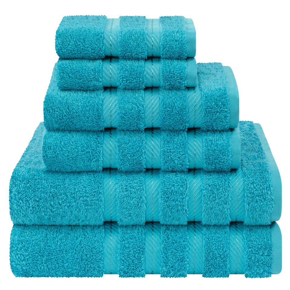 American Soft Linen luxury towel set on a rack, plush and quick-drying for daily use.