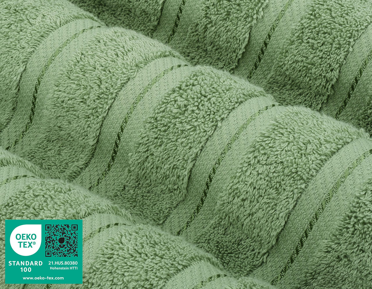 American Soft Linen sage green hand towels draped over towel rod for everyday softness