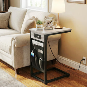 AMHANCIBLE end table setup in a camper for bedside access and surface space.