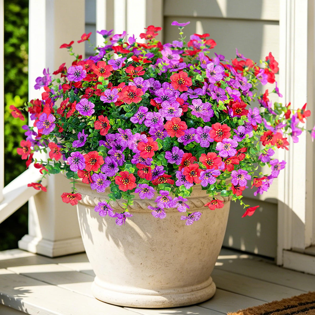 Ammyoo 12-pack outdoor daisy bundles in purple and red brighten the front door.