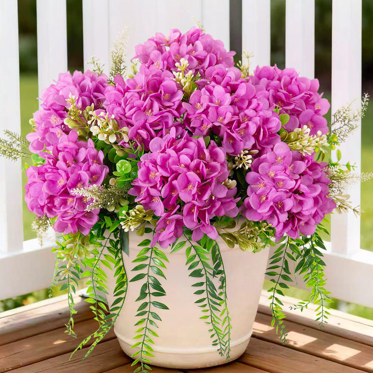 Ammyoo artificial hydrangea flowers in purple with eucalyptus for outdoor decor.