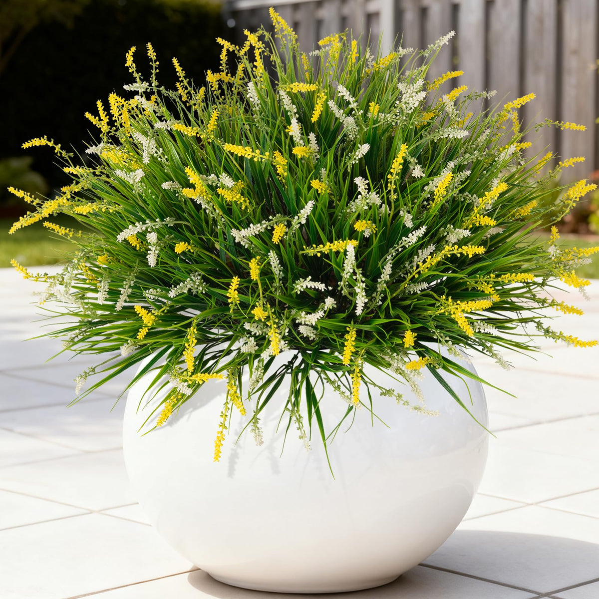 Ammyoo artificial monkey grass with dense leaves for durable outdoor decor.