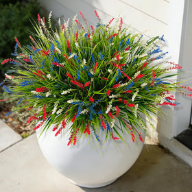 Ammyoo artificial monkey grass for outdoor use adds evergreen color to porches.