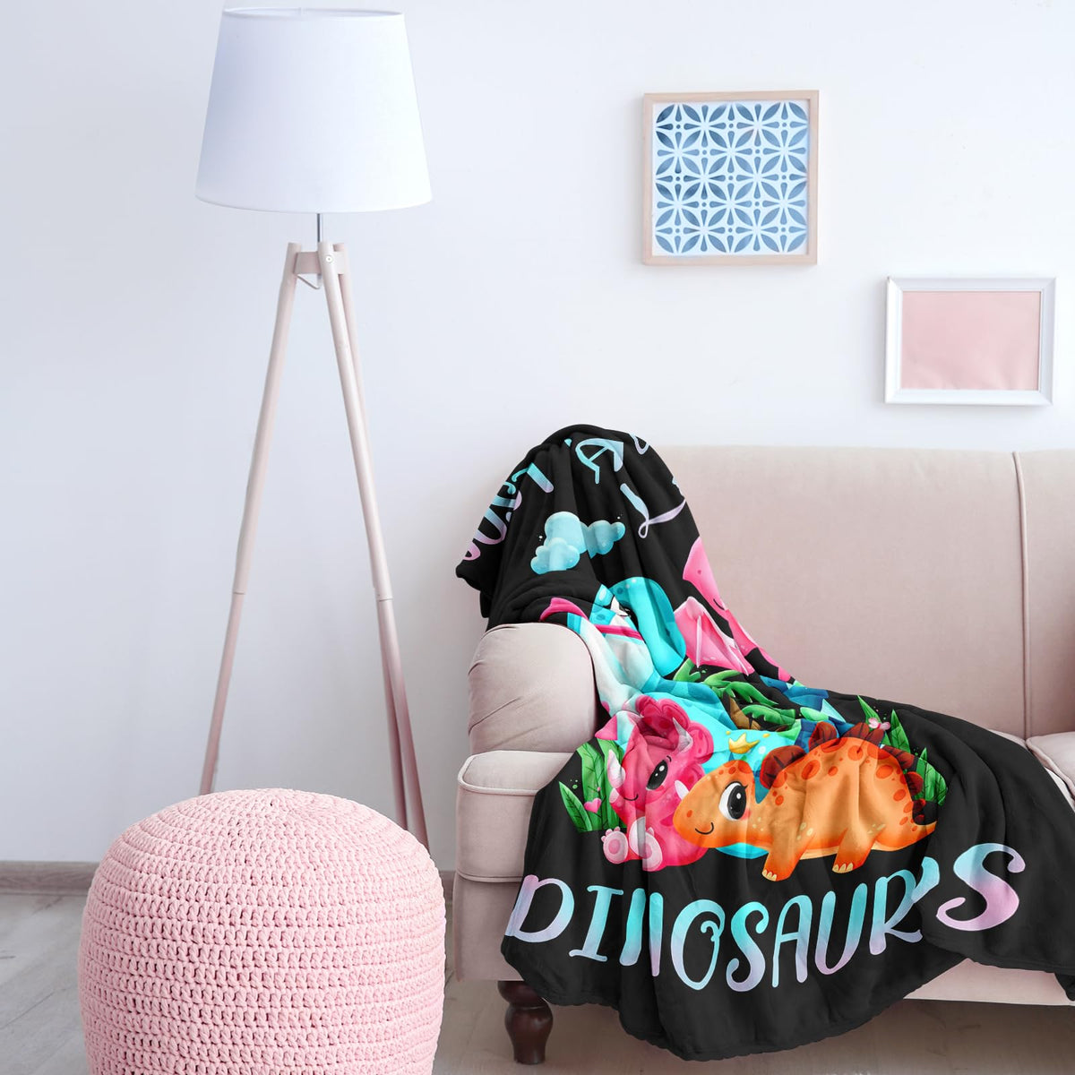 Amonee-YL dinosaur blanket used as a travel rug in a car setting.