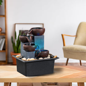 AMOOTEK self-contained fountain demonstrating no-piping setup on a tabletop.
