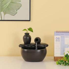 Andady black fountain complements modern decor with subtle water motion.