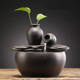 Andady ceramic tabletop fountain in black decorates indoor spaces with soothing water flow.