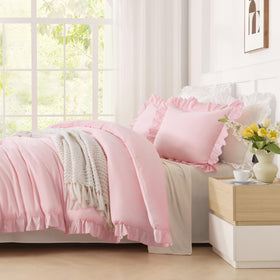 Andency pink comforter in a chic bedroom evokes shabby chic style