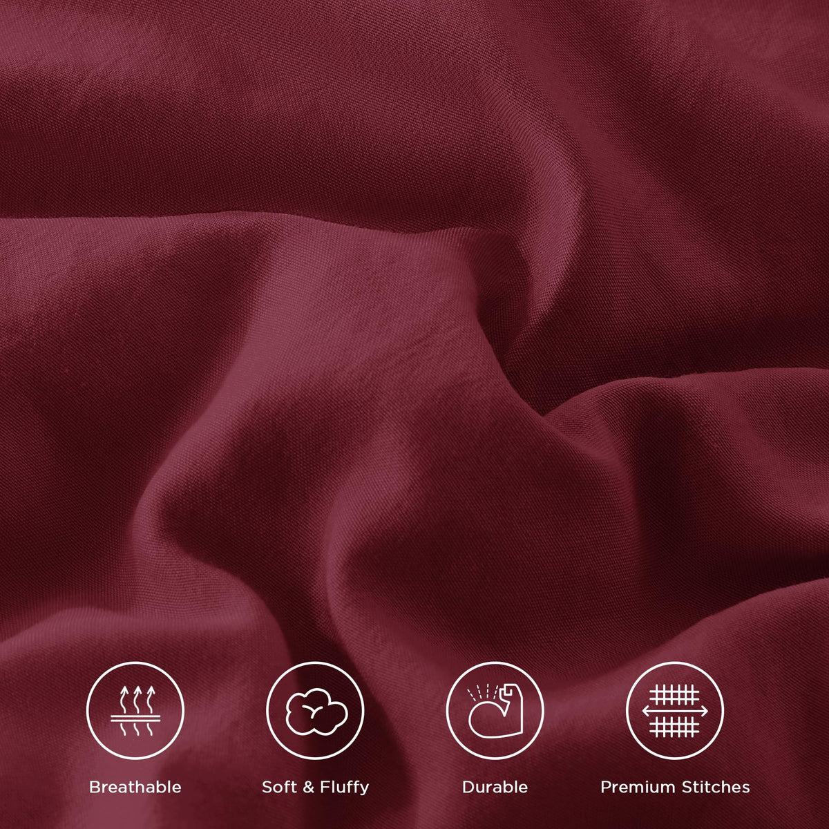 Andency bedroom scene with burgundy comforter on bed