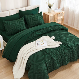 Andency emerald comforter close-up shows tufted detailing and lush color