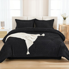 Andency comforter closeup shows geometric texture for a modern, relaxed look.