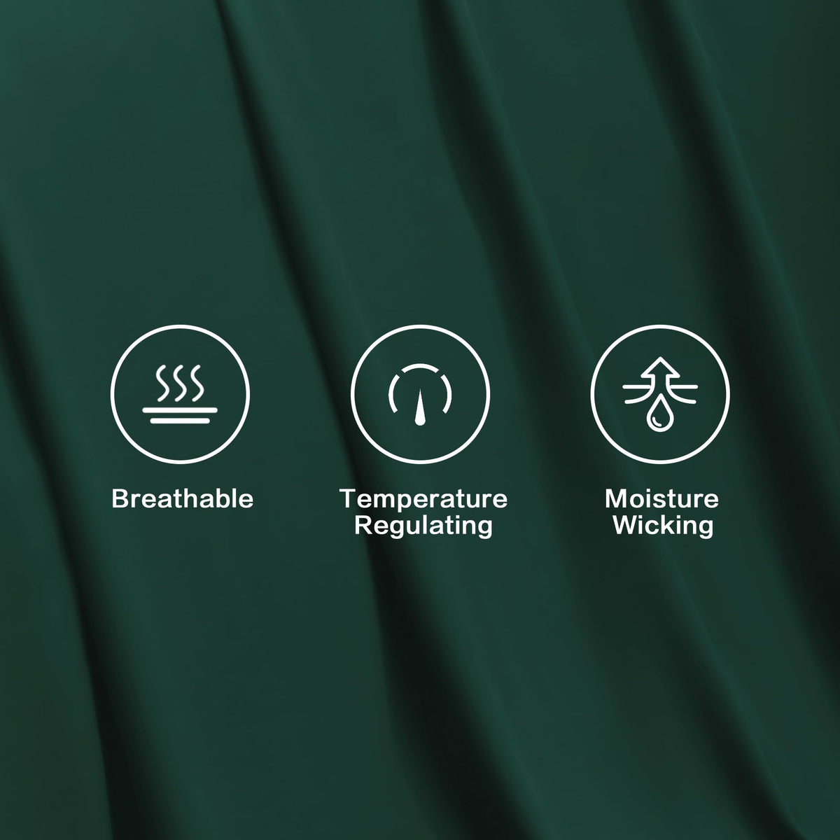 Pillowcases with matching emerald tone complete a cohesive bed setup.