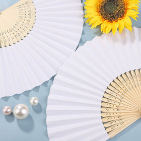 Aneco party setup showing portable handheld fans for summer cooling