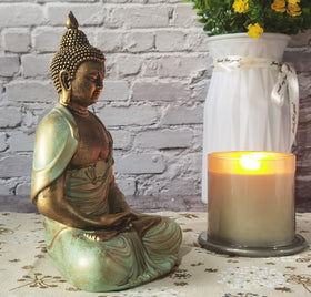 Angel Shine gold Buddha statue in a boho bedroom ambiance