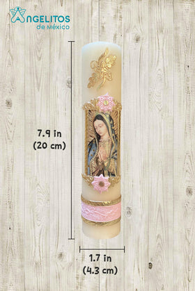 Pink candle from Angelitos de Mexico lit with a warm glow