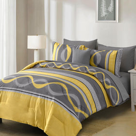 Anibedding patchwork striped design close-up emphasizing warm yellow tones.