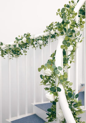 Anna's Whimsy shopfront display with floral garland for attraction